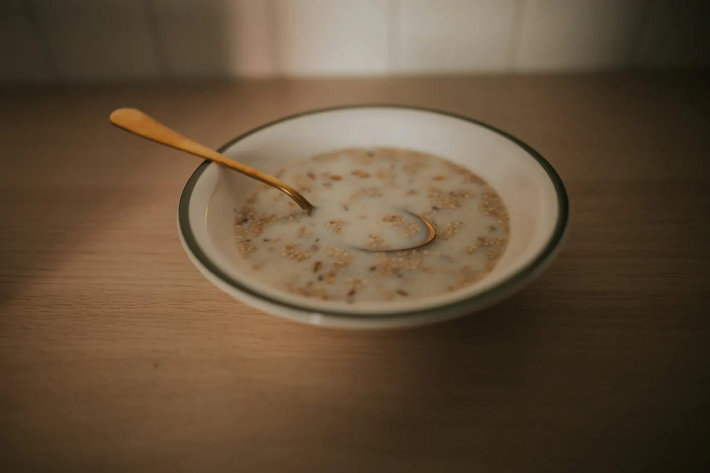 A shallow bowl of creamy rice pudding dusted with cinnamon