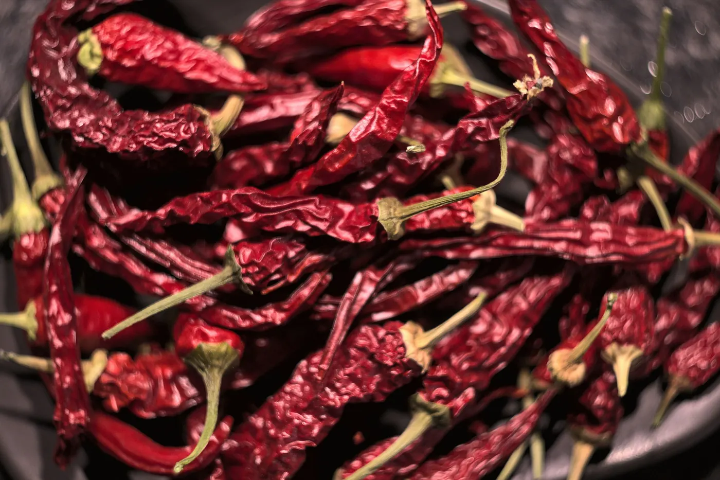 A dense mass of dark red dried chile pods