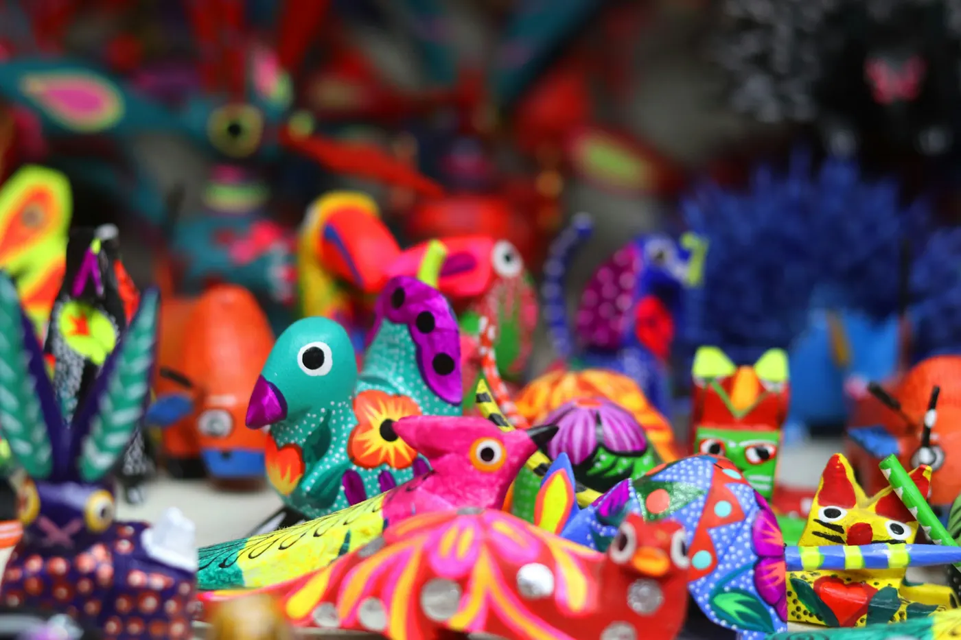 Brightly painted wooden animal carvings crowded together