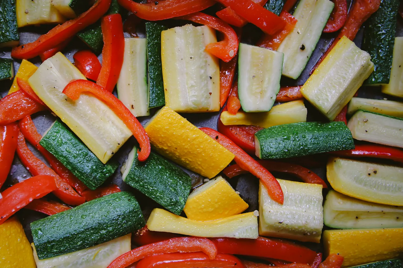 Chopped zucchini, red pepper and yellow squash ready for cooking