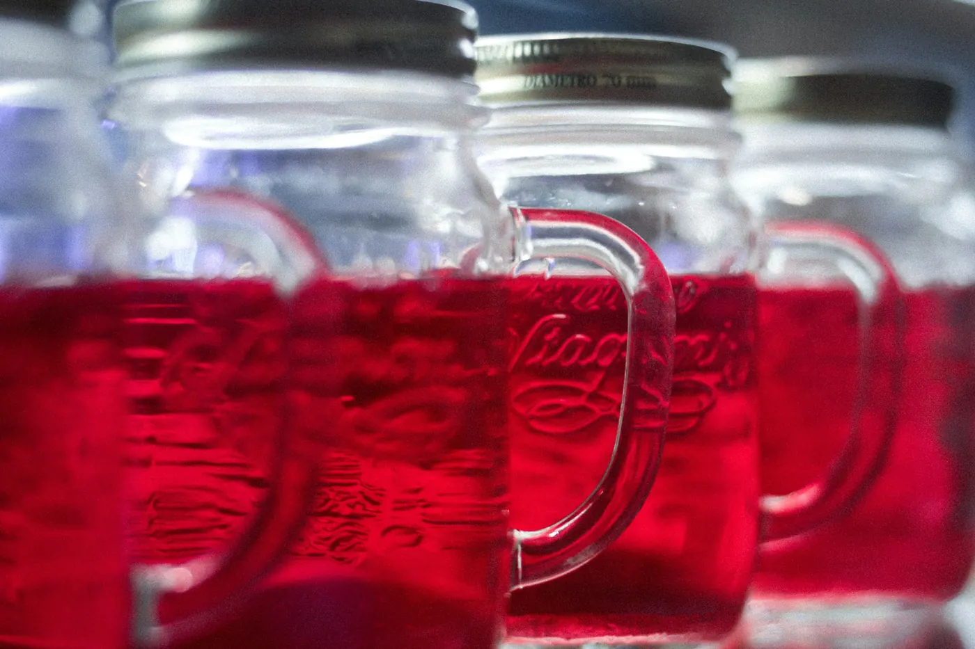 Glass mugs filled with a deep red drink