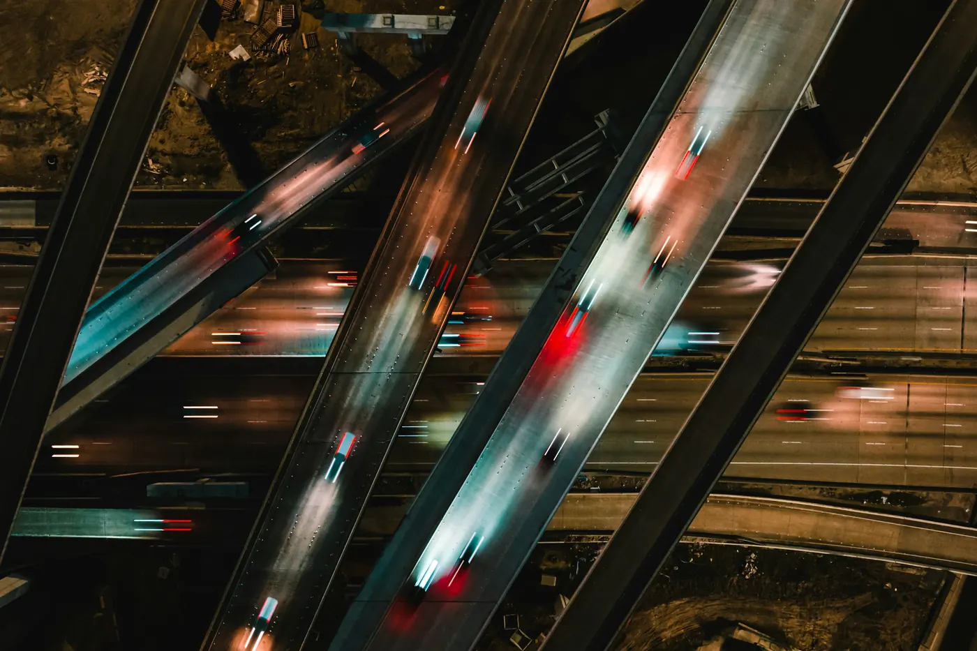Light trails from traffic across a stack of freeway ramps at night