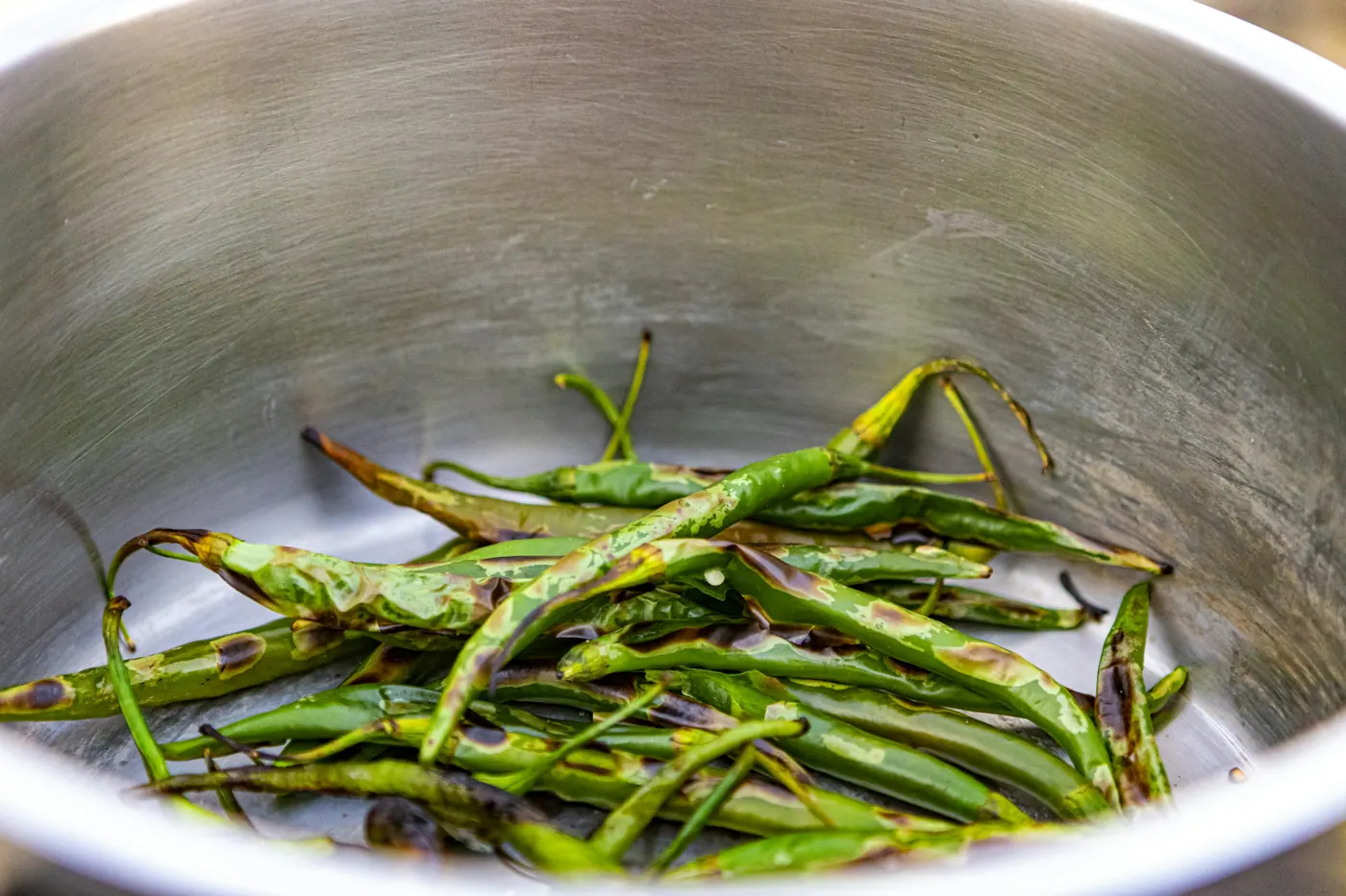 Strips of roasted pepper in a shallow pan