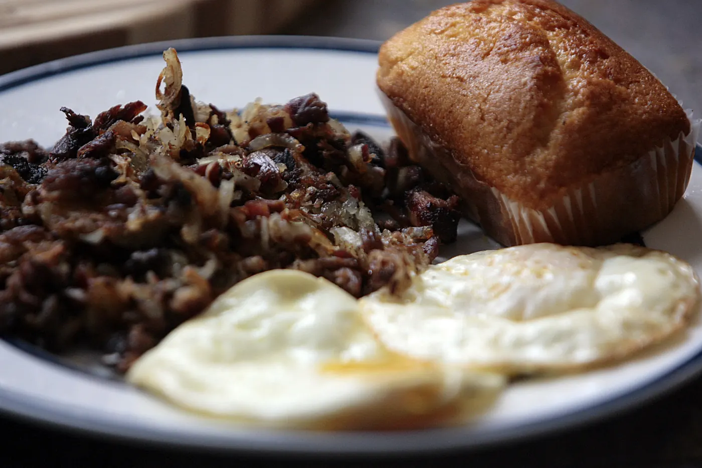 Shredded dark meat served with two fried eggs and bread