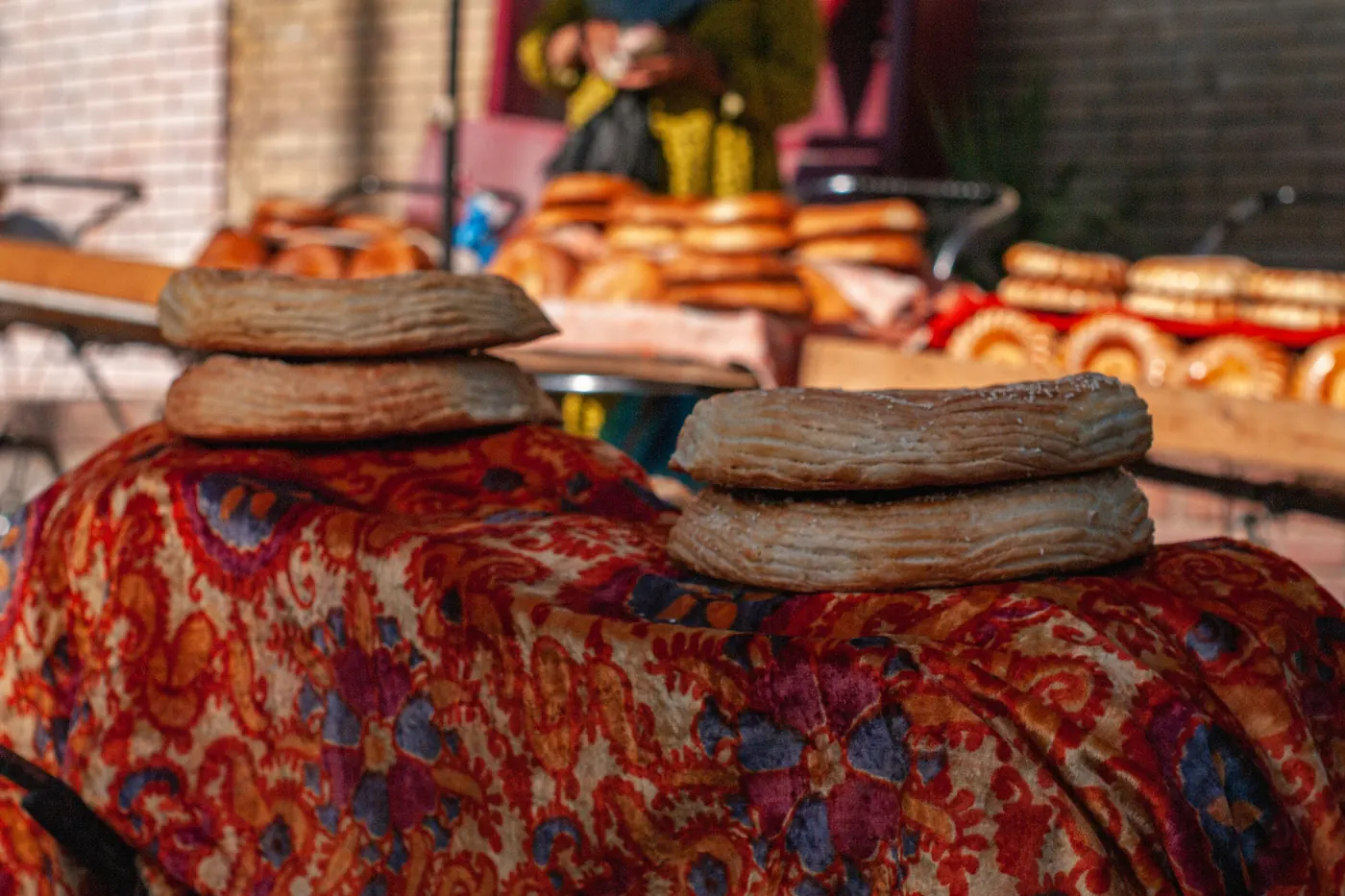 Stacks of tortillas piled on a market table